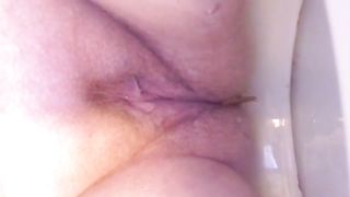 Hairy mature woman shitting in close up