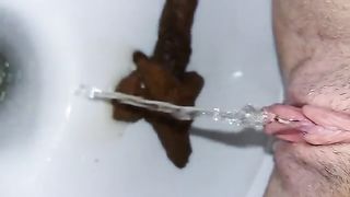 Hairy teen pooping long turd in toilet