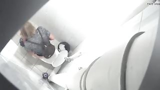 Blonde babe using a public bathroom