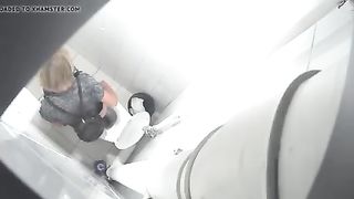 Blonde babe using a public bathroom