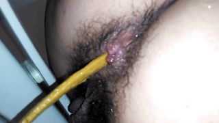 Hairy babe pooping in close up
