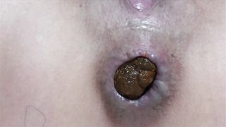 Close up of a sexy milf shitting