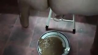 Liquid shit on a white plate