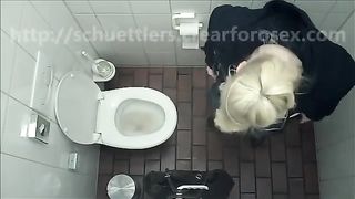Blonde babe using a public bathroom