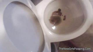 Chubby babe pooping in toilet