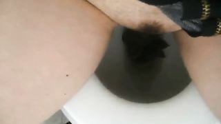 Girl shitting on the toilet