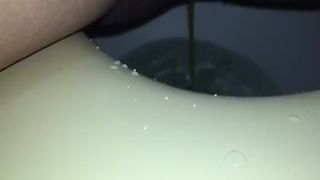 Shaved babe shitting and peeing