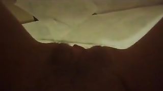 Shaved girl shitting