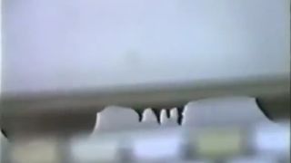 Spying on a mature woman that's pooping