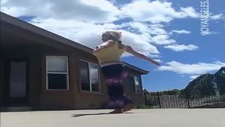 Blonde girl pooping two times outdoor