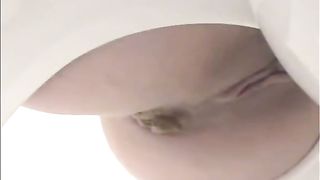 Sexy babe using a homemade toilet