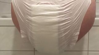 Amateur babe shitting in white diapers