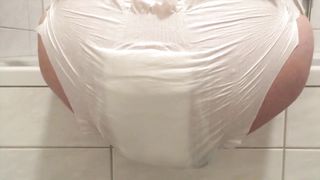 Amateur babe shitting in white diapers