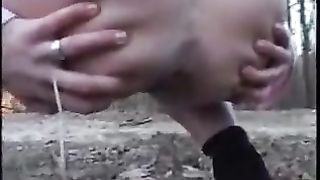 Kinky girl shitting outdoor