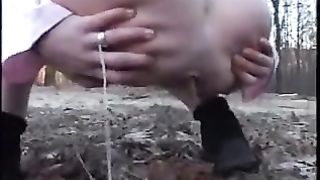 Kinky girl shitting outdoor