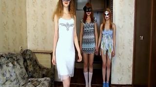 Three young girls pooping on black high heels