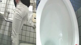Japanese babe using a public bathroom