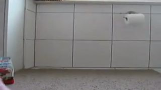 Pierced teen pooping on white plate