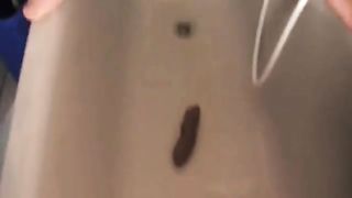 Smearing shit on dildo before riding it