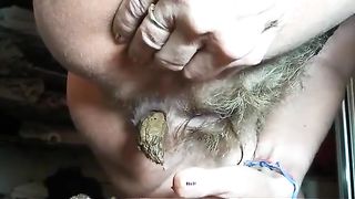 Stuffed her hairy pussy with shit
