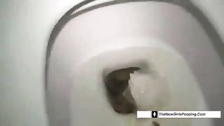 Dark haired babe pooping