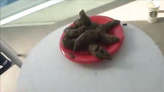 Huge pile of shit on a red plate