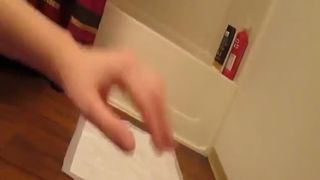 Playing with her pussy while pooping