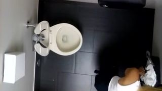 Spying on a tattooed babe shitting