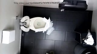 Spying on a tattooed babe shitting