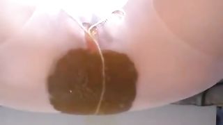 Blonde babe shitting in white pantyhose