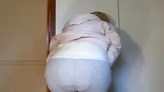 Blonde mommy shitting in grey pants