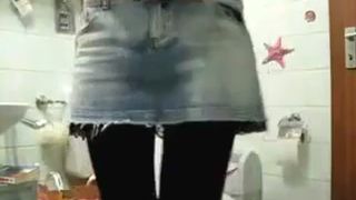 Blonde babe shitting over toilet