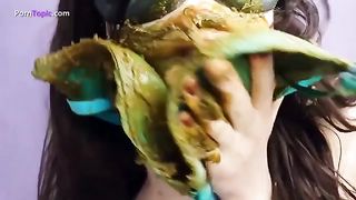 Dark haired college girl smears shit on her entire body