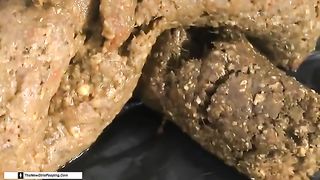 Dark haired babe pooping a lot