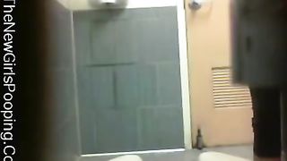 Amateur babe pooping over toilet