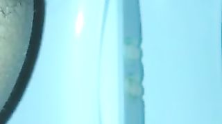 Pushing big turd over toilet