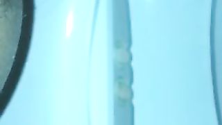 Pushing big turd over toilet