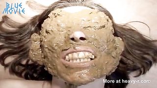 He smears shit on her entire face