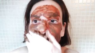 Smearing shit on her face and pussy