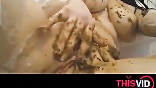Brunette babe smears shit on nude body