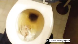Amateur babe shitting over toilet