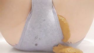 Shitting in grey panties