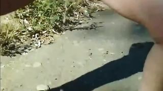 Horny milf shitting outdoor