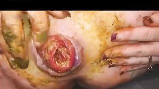 Redhead babe masturbating with poop