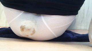 Chubby babe pooping in white panties