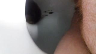 Shaved fat girl shitting