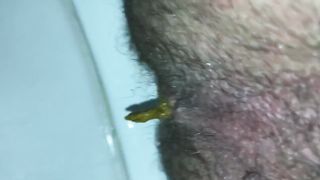 Hairy babe shitting in toilet