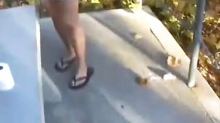 Sexy blonde shitting in a forest