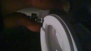 Thai girl pooping over toilet