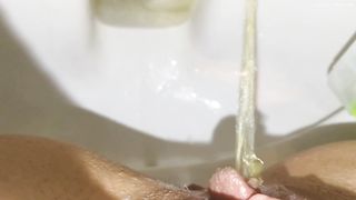 Fingering her pussy while pooping